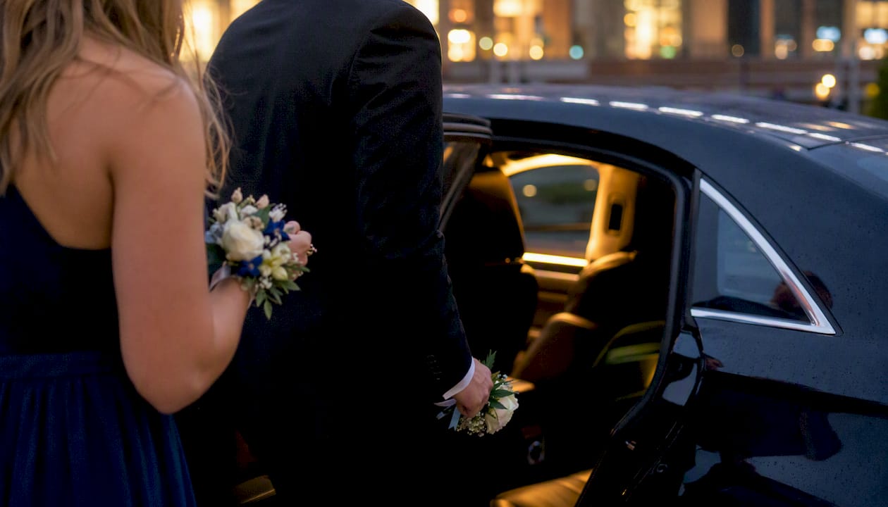 Students boarding prom ride vehicle hands close-up